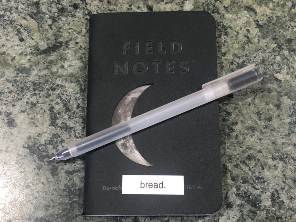 a black field notes notebook labeled 'bread'